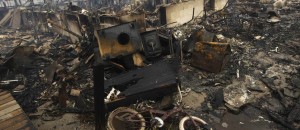 A view shows homes devastated by fire and the effects of Hurricane Sandy at the Breezy Point section of the Queens borough of New York
