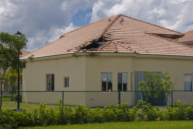 can lightning strike through a house roof
